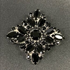 Elegant Black and Silver Brooch
